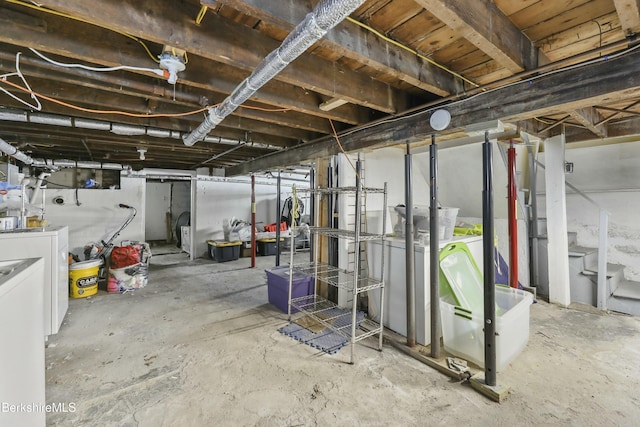 unfinished basement featuring separate washer and dryer