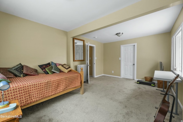 carpeted bedroom featuring baseboards