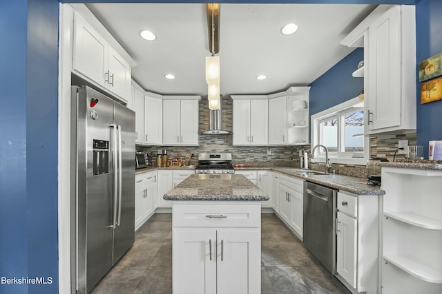 kitchen with a kitchen island, stainless steel appliances, white cabinetry, open shelves, and a sink