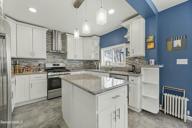 kitchen featuring open shelves, wall chimney exhaust hood, white cabinetry, and stainless steel appliances