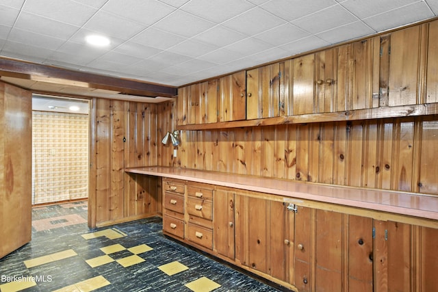 interior space featuring dark floors and built in desk