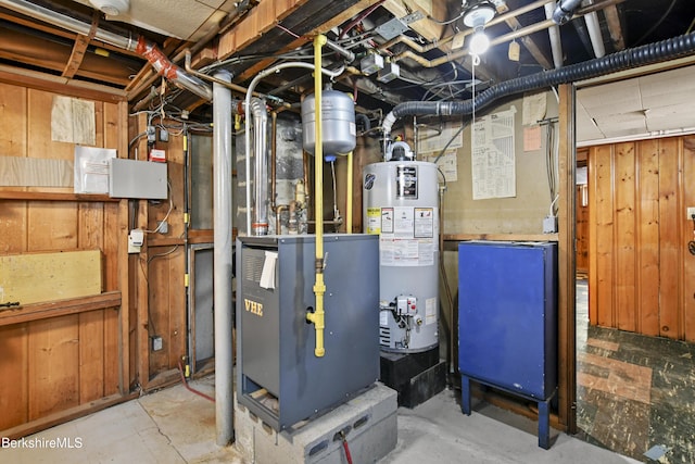 utilities featuring gas water heater and a heating unit