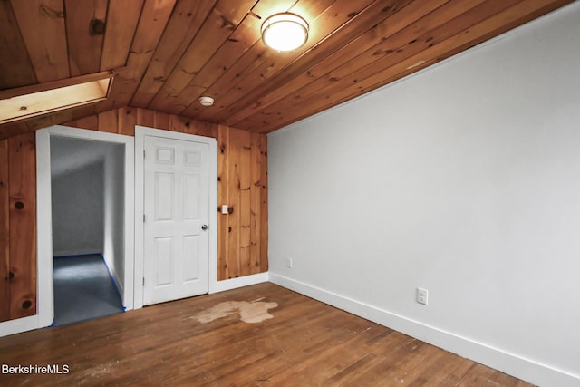 111 Columbia St, Adams, MA 01220 - spare room featuring baseboards, wooden ceiling, vaulted ceiling, and wood finished floors