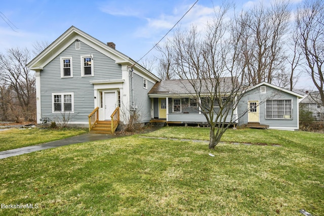 111 Columbia St, Adams, MA 01220 - view of front facade with entry steps, a front lawn, and a chimney