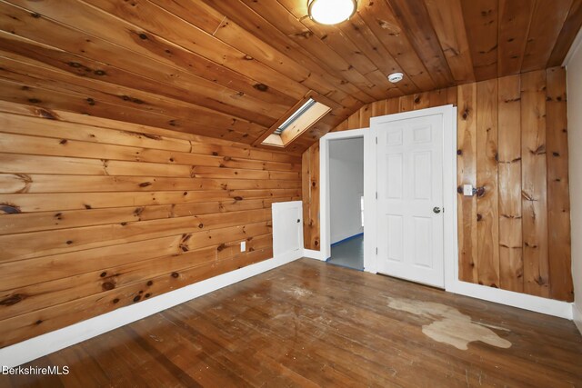 111 Columbia St, Adams, MA 01220 - additional living space with wood walls, vaulted ceiling with skylight, hardwood / wood-style floors, and wood ceiling