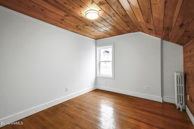 111 Columbia St, Adams, MA 01220 - empty room featuring baseboards, wooden ceiling, radiator, wood finished floors, and lofted ceiling