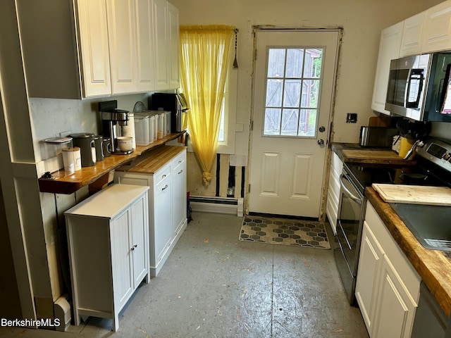 89-91 N Summer St, Adams, MA 01220 - kitchen featuring appliances with stainless steel finishes, butcher block counters, white cabinetry, and concrete floors