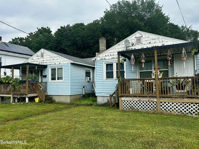 89-91 N Summer St, Adams, MA 01220 - back of house with covered porch, a yard, and cooling unit
