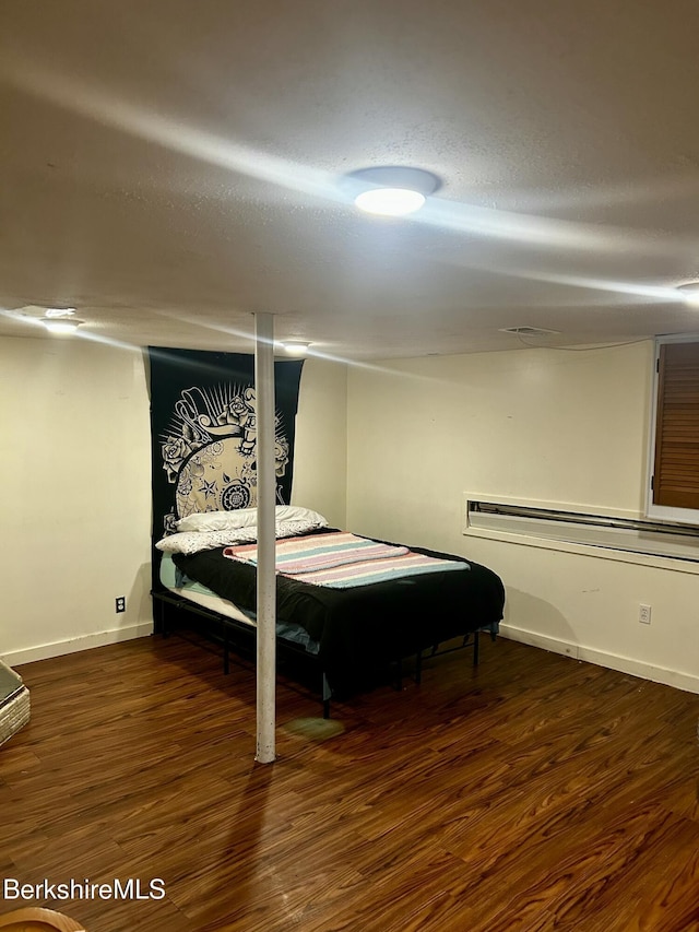 89-91 N Summer St, Adams, MA 01220 - bedroom with wood finished floors and a baseboard radiator