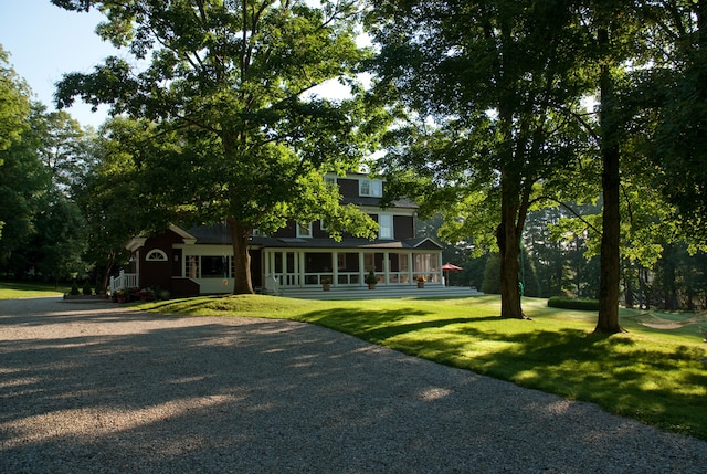 221 Bulkley St, Williamstown, MA 01267 - view of front of house featuring a sunroom and a front lawn