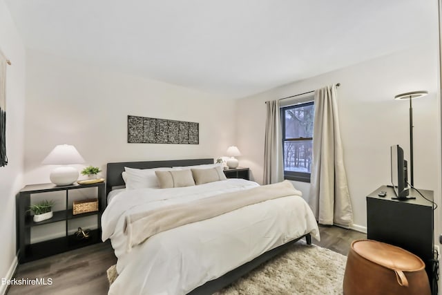 bedroom featuring dark wood-type flooring