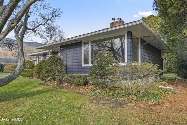 view of home's exterior featuring a yard