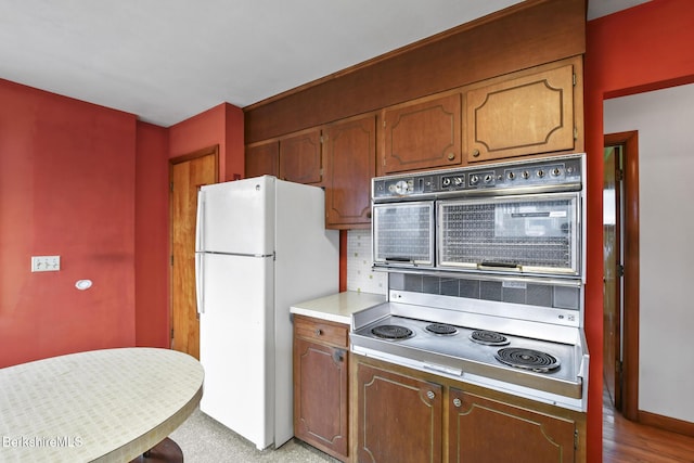 kitchen featuring cooktop and white refrigerator