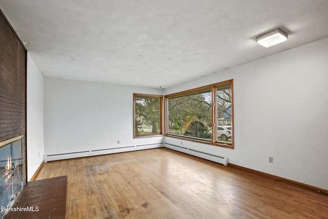 unfurnished room with light hardwood / wood-style flooring