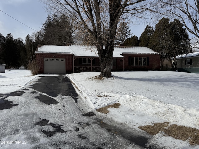 single story home with a garage