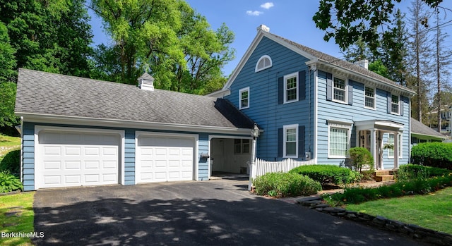 40 Crandall St, Adams, MA 01220 - view of front of home featuring a chimney and driveway