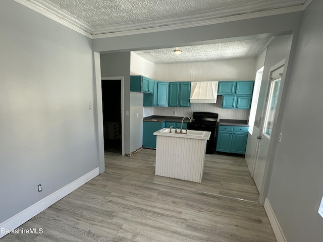 kitchen featuring crown molding, premium range hood, black electric range, blue cabinets, and light wood-type flooring