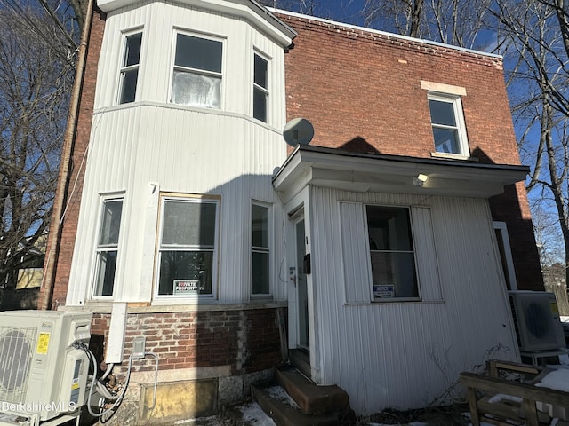 view of side of property featuring ac unit