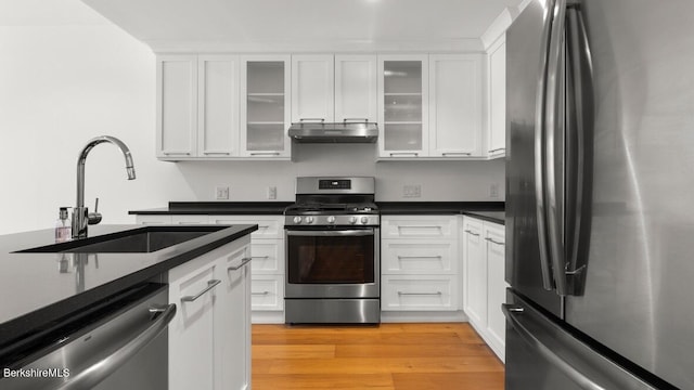 kitchen featuring white cabinetry, sink, and appliances with stainless steel finishes