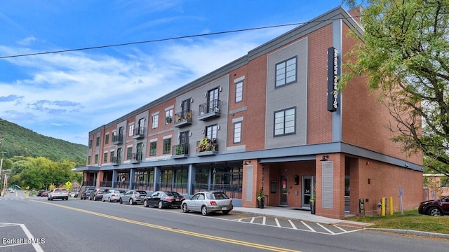 view of building exterior with a mountain view