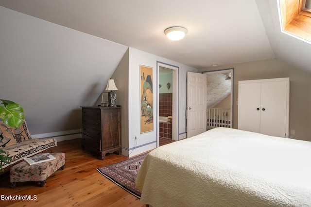 662 Foley Rd, Sheffield, MA 01257 - bedroom with hardwood / wood-style floors, lofted ceiling, and ensuite bathroom