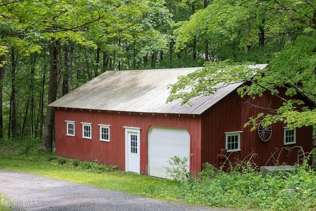662 Foley Rd, Sheffield, MA 01257 - detached garage featuring a wooded view