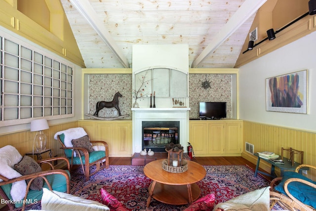 662 Foley Rd, Sheffield, MA 01257 - living area featuring wood finished floors, a wainscoted wall, a glass covered fireplace, and wood ceiling