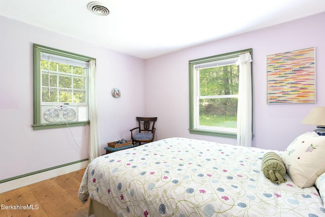 662 Foley Rd, Sheffield, MA 01257 - bedroom featuring multiple windows and wood finished floors