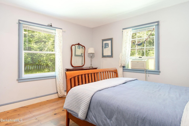662 Foley Rd, Sheffield, MA 01257 - bedroom featuring wood finished floors, multiple windows, and cooling unit