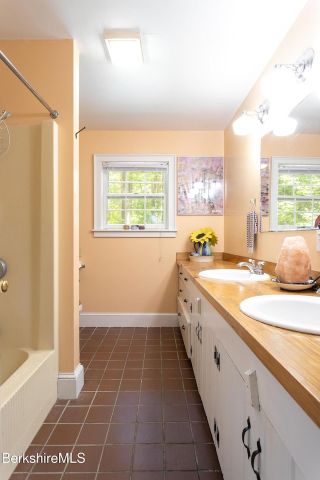 662 Foley Rd, Sheffield, MA 01257 - full bathroom with double vanity, tile patterned flooring, and shower / tub combination