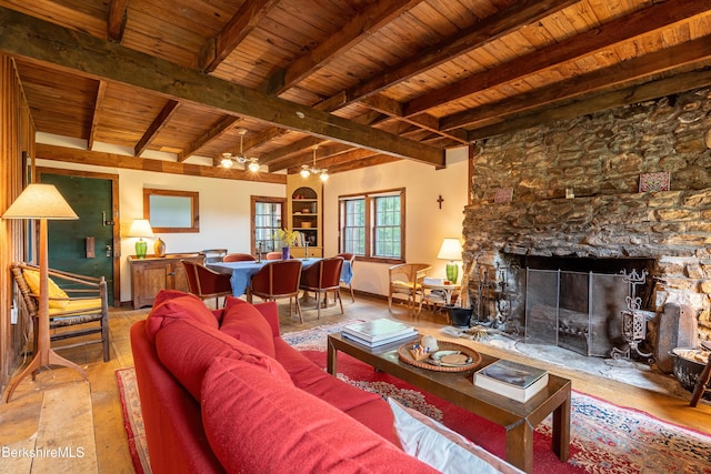 living area featuring a chandelier, a fireplace, wooden ceiling, wood-type flooring, and beam ceiling