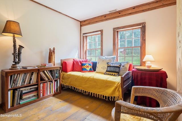 bedroom with hardwood / wood-style floors and visible vents