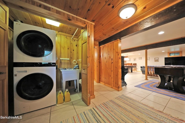 233 Algerie Rd, Becket, MA 01223 - laundry room featuring stacked washer and clothes dryer, tile patterned flooring, wooden ceiling, wood walls, and recessed lighting