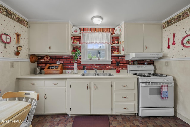 15 Summit Ave, Adams, MA 01220 - kitchen featuring white gas range, under cabinet range hood, light countertops, wallpapered walls, and brick patterned floors