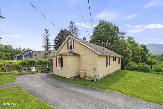 15 Summit Ave, Adams, MA 01220 - view of front of house with a chimney, a front yard, and a shingled roof