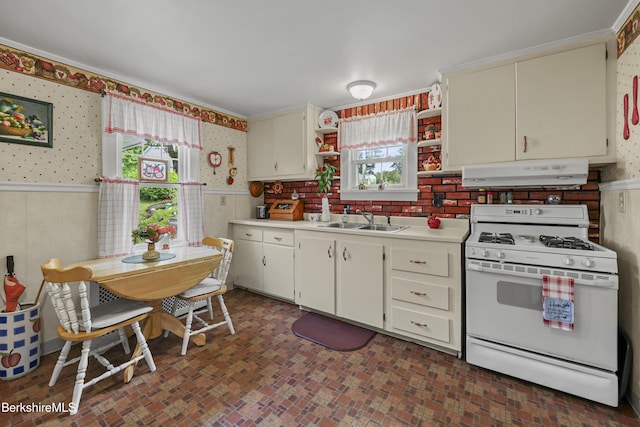 15 Summit Ave, Adams, MA 01220 - kitchen featuring gas range gas stove, under cabinet range hood, wallpapered walls, wainscoting, and light countertops