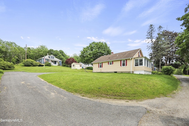 15 Summit Ave, Adams, MA 01220 - view of front of house featuring a chimney, a front lawn, driveway, and an outbuilding