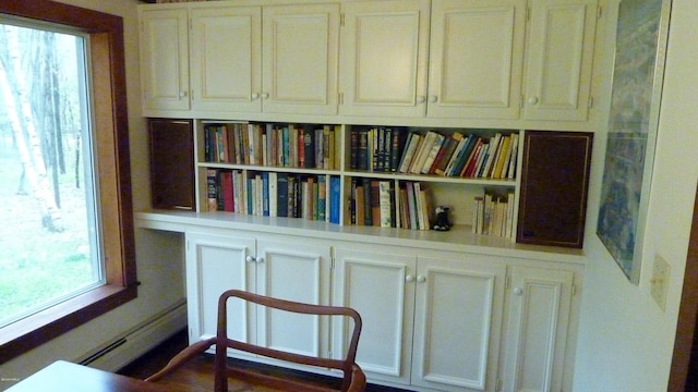 living area featuring baseboard heating