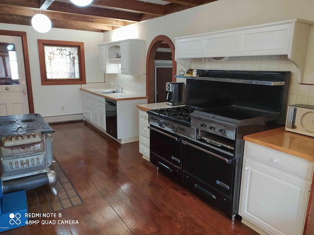 kitchen featuring decorative backsplash, beam ceiling, white cabinetry, and sink