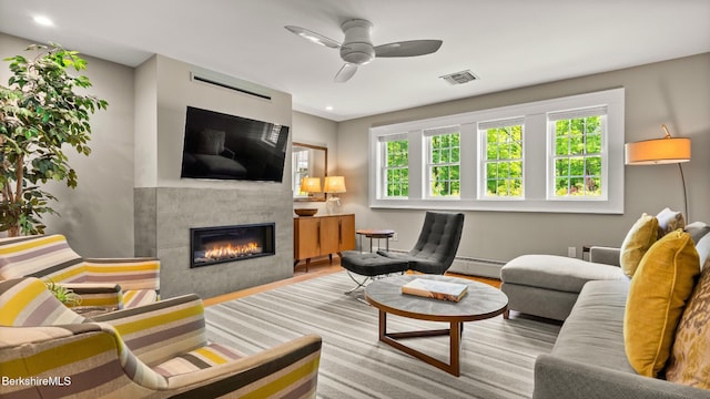 13 Taconic Ave, Lenox, MA 01240 - living area featuring a baseboard radiator, a fireplace, healthy amount of natural light, a ceiling fan, and recessed lighting