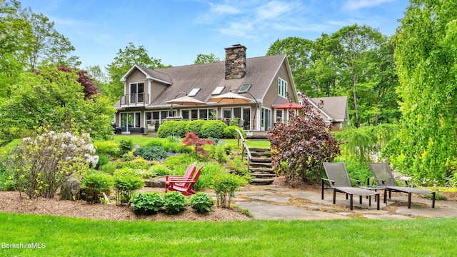 13 Taconic Ave, Lenox, MA 01240 - rear view of house featuring stairway, a chimney, a lawn, and a deck