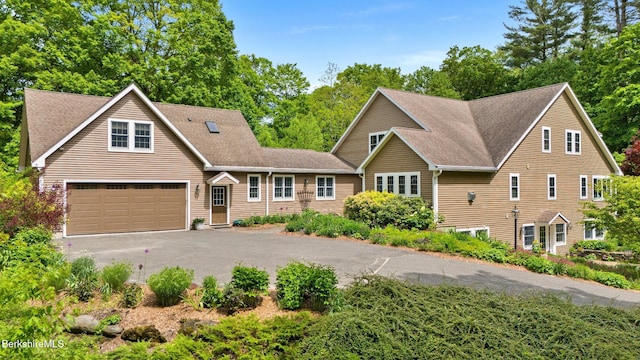 13 Taconic Ave, Lenox, MA 01240 - view of front of house featuring asphalt driveway, a garage, and a shingled roof