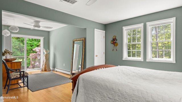 13 Taconic Ave, Lenox, MA 01240 - bedroom featuring multiple windows, wood finished floors, and baseboard heating
