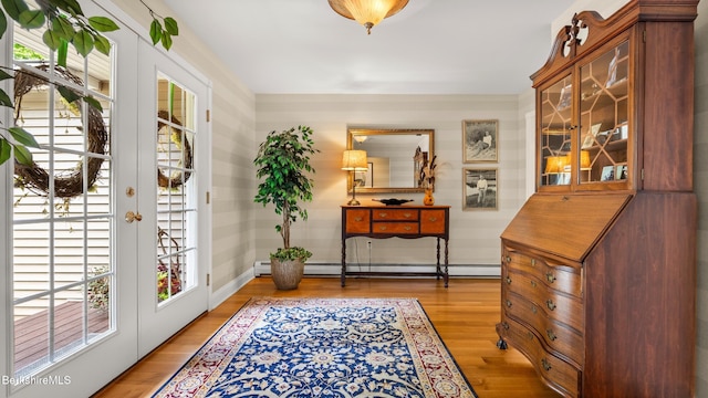 13 Taconic Ave, Lenox, MA 01240 - entryway featuring a baseboard heating unit, light wood-style flooring, and french doors