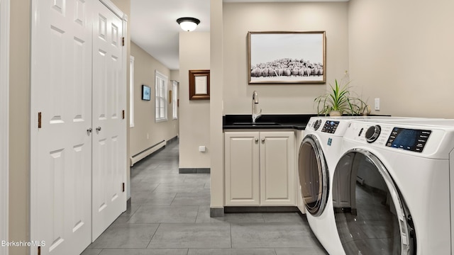 13 Taconic Ave, Lenox, MA 01240 - laundry room featuring a baseboard heating unit, separate washer and dryer, cabinet space, and light tile patterned flooring