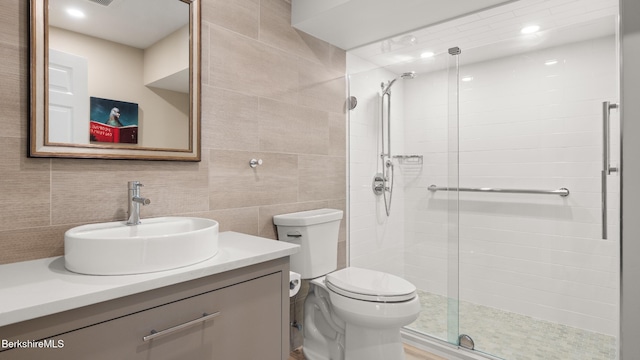 13 Taconic Ave, Lenox, MA 01240 - full bathroom featuring tile walls, a shower stall, vanity, and decorative backsplash