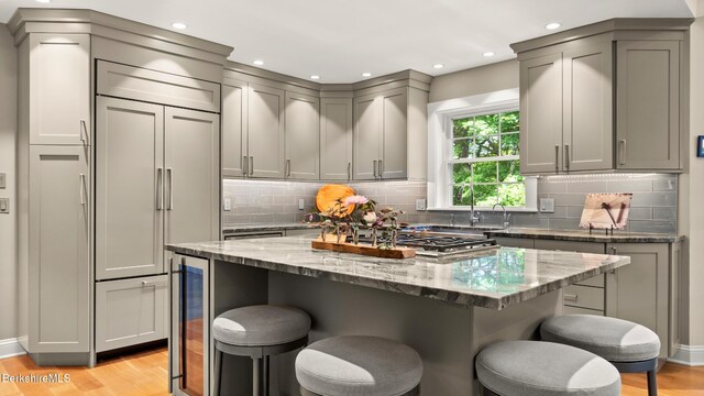 13 Taconic Ave, Lenox, MA 01240 - kitchen featuring wine cooler, gray cabinets, light wood-style floors, a breakfast bar area, and recessed lighting