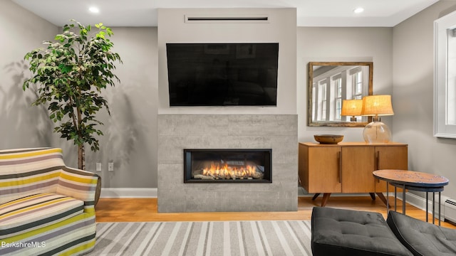13 Taconic Ave, Lenox, MA 01240 - living room with wood finished floors, a tiled fireplace, and recessed lighting
