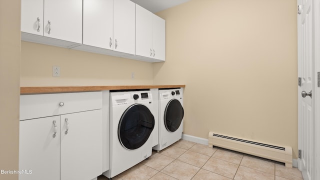 13 Taconic Ave, Lenox, MA 01240 - laundry room with a baseboard radiator, washer and dryer, cabinet space, and light tile patterned floors