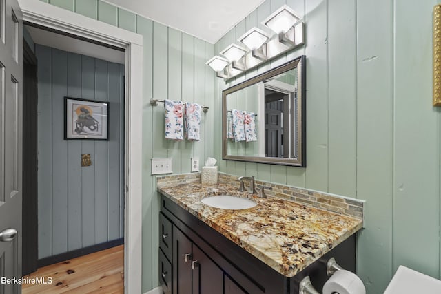 171 Lake Shore Dr, Otis, MA 01253 - half bath featuring vanity and wood finished floors